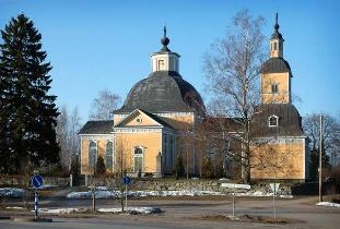 Kuva: Taipalsaaren kirkko aamuauringossa.&nbsp;(Seppo Pelkonen&nbsp;25.3.2007)